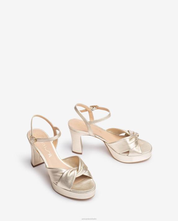 Unisa kvinnor guld sandal med breda korsband 06DT17